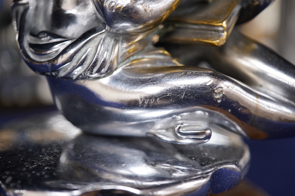 Two chrome car mascots, one in the form of an eagle stamped Finnigans London, wingspan 26cm, and the other of a classical child writing, mounted on a substantial radiator cap and oak base. Condition - fair to good, some